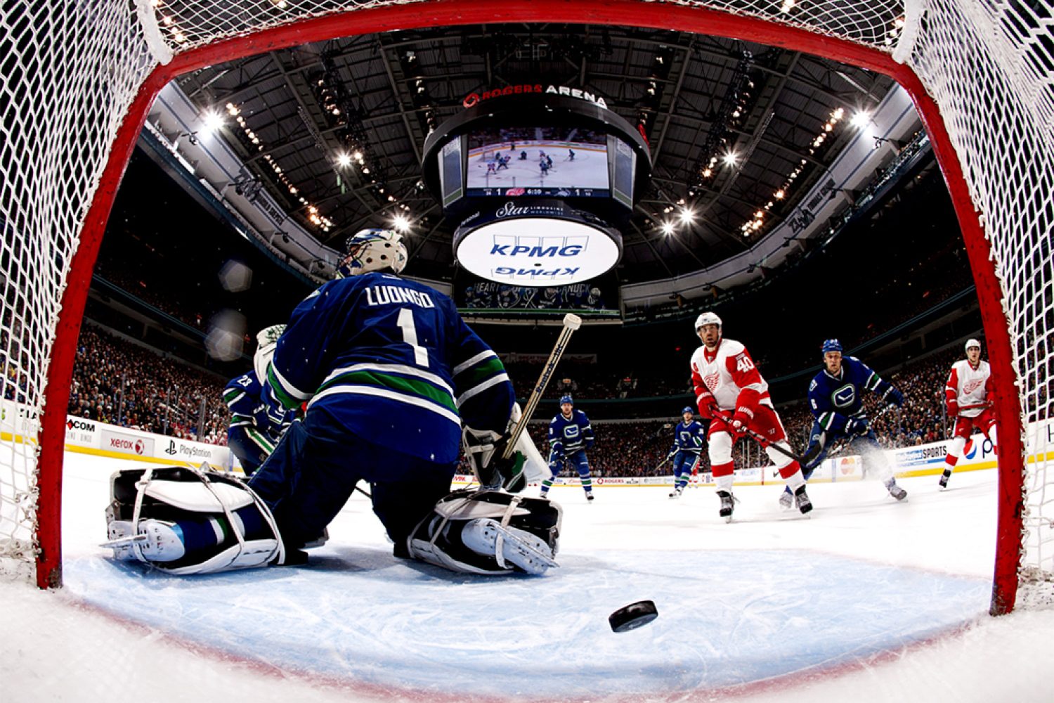 VANCOUVER, CANADA - FEBRUARY 2: Henrik Zetterberg #40 of the Detroit Red Wings watches the puck go behind Roberto Luongo #1 of the Vancouver Canucks during their NHL game  at Rogers Arena February 2, 2012 in Vancouver, British Columbia, Canada. (Photo by Jeff Vinnick/NHLI via Getty Images)