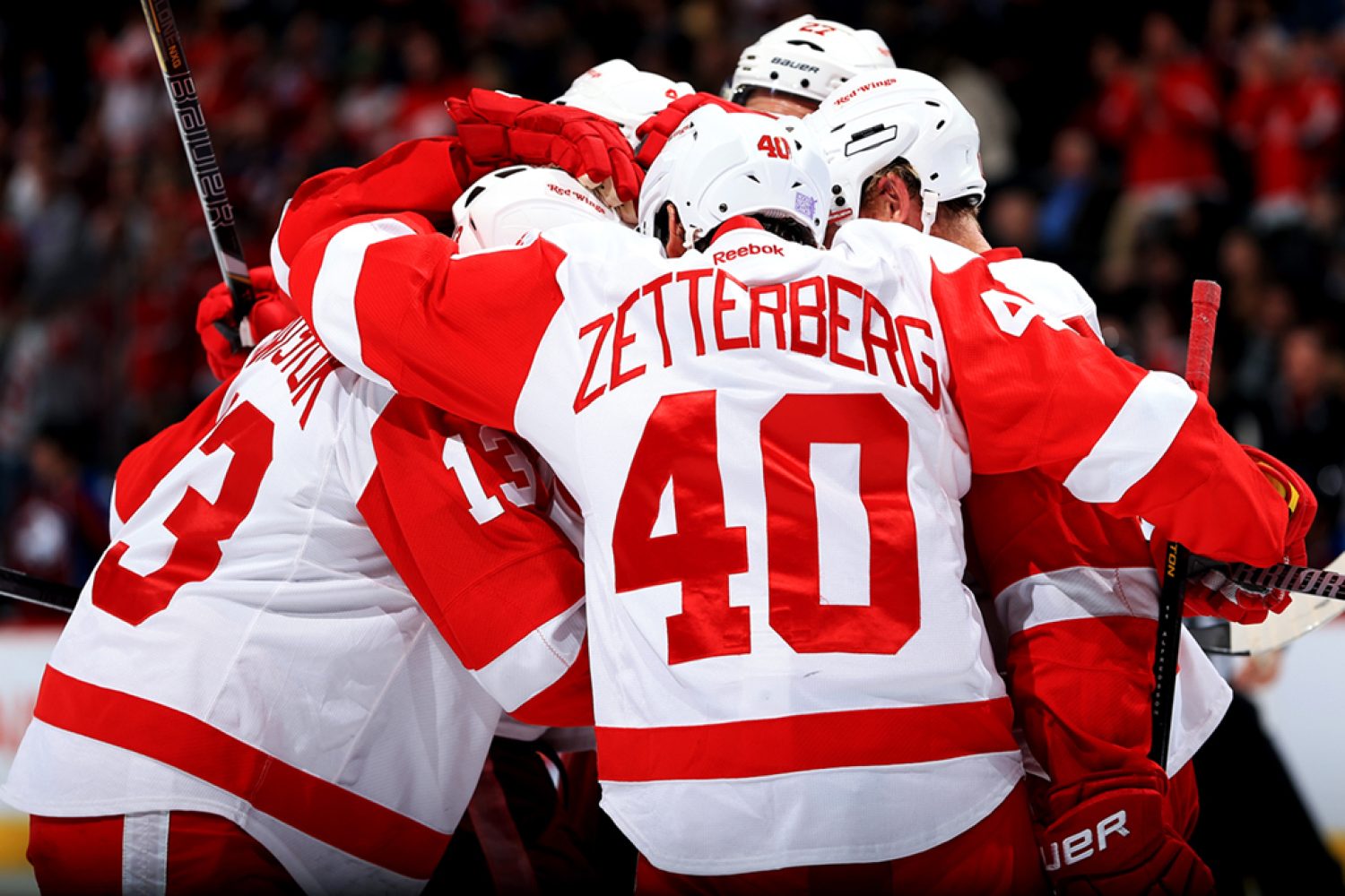 DENVER, CO - OCTOBER 17:  Henrik Zetterberg #40 of the Detroit Red Wings and his teammates celebrate an insurance goal by Pavel Datsyuk #13 of the Detroit Red Wings against the Colorado Avalanche in the thrid period at Pepsi Center on October 17, 2013 in Denver, Colorado. The Red Wings defeated the Avalanche 4-2.  (Photo by Doug Pensinger/Getty Images)